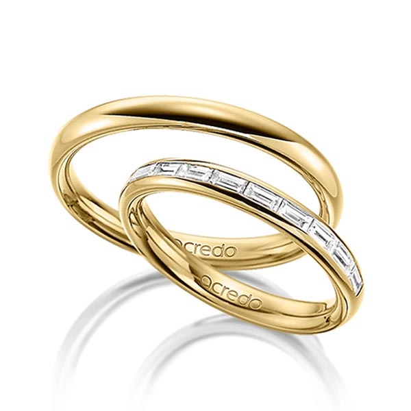 Set klassieke Memoire-trouwringen in buiten geelgoud 14 kt. , binnen geelgoud 14 kt. half gezet met in totaal 0,5 ct. Baguette-Diamant tw,vs van acredo