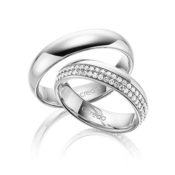Set klassieke Memoire-trouwringen in buiten grijsgoud 14 kt. , binnen grijsgoud 14 kt. volledig gezet met in totaal 0,752 ct. Briljant tw/si van acredo - A-1536-8 Set klassieke Memoire-trouwringen in buiten grijsgoud 14 kt. , binnen grijsgoud 14 kt. volledig gezet met in totaal 0,752 ct. Briljant tw/si van acredo - A-1536-8