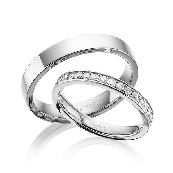 Set klassieke Memoire-trouwringen in buiten witgoud 14 kt. , binnen witgoud 14 kt. half gezet met in totaal 0,34 ct. Briljant tw/si van acredo