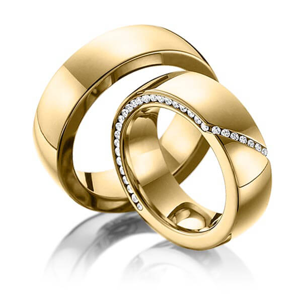 Set klassieke Memoire-trouwringen in geelgoud 14 kt. half gezet met in totaal 0,29 ct. Briljant tw/si van Eternal Touch