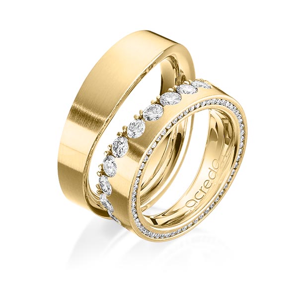 Set klassieke Memoire-trouwringen in geelgoud 14 kt. half gezet met in totaal 1,385 ct. Briljant tw/si van acredo