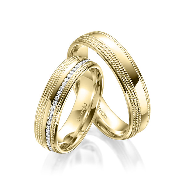 Set Klassieke Memoire-trouwringen in geelgoud 14 kt. volledig gezet met in totaal 0,295 ct. Briljant tw/si van acredo