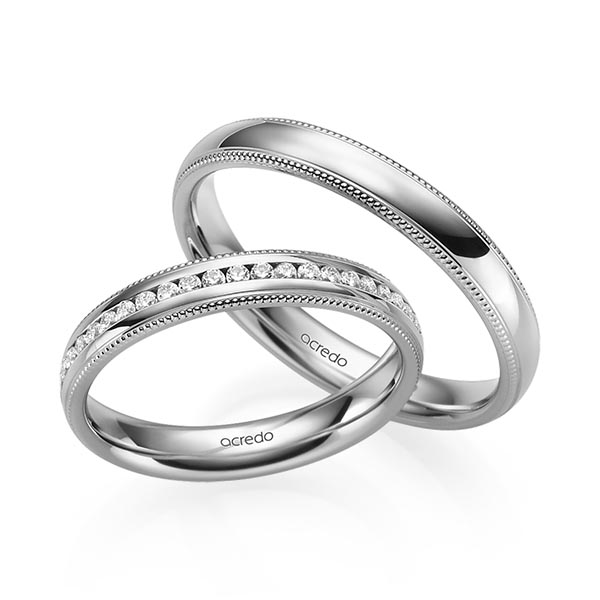 Set Klassieke Memoire-trouwringen in grijsgoud 14 kt. half gezet met in totaal 0,192 ct. Briljant tw/si van acredo