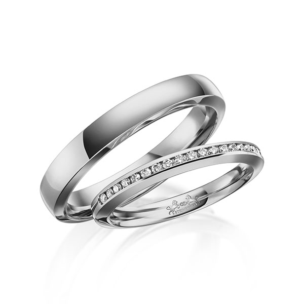 Set klassieke Memoire-trouwringen in grijsgoud 14 kt. half gezet met in totaal 0,23 ct. Briljant tw/si van Steinberg