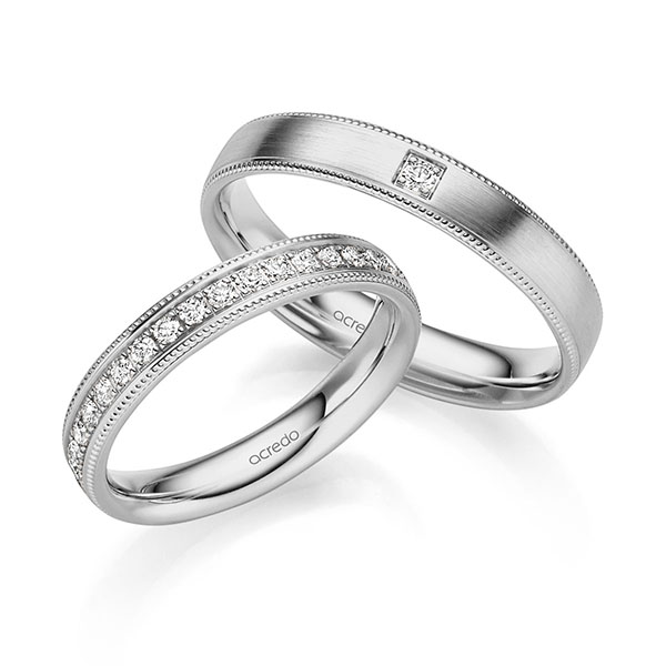 Set Klassieke Memoire-trouwringen in grijsgoud 14 kt. half gezet met in totaal 0,31 ct. Briljant tw/si van acredo