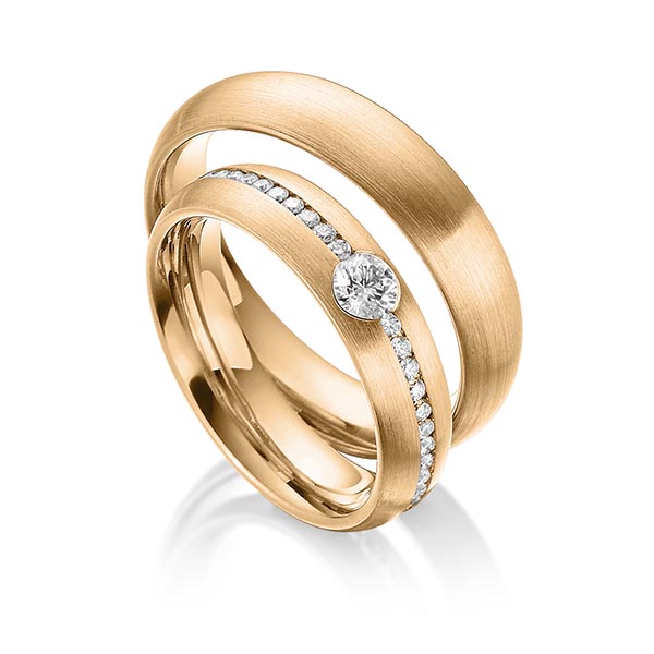 Set klassieke Memoire-trouwringen in roségoud 14 kt. volledig gezet met in totaal 0,69 ct. Briljant tw/si van Steinberg