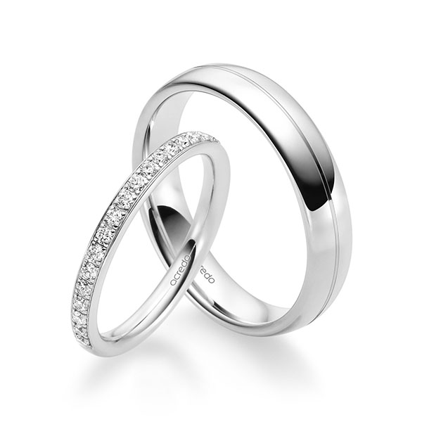 Set klassieke Memoire-trouwringen in witgoud 14 kt. half gezet met in totaal 0,285 ct. Briljant tw/si van acredo