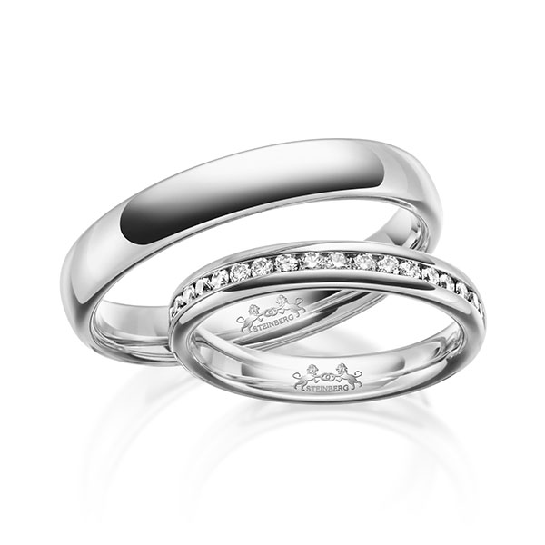Set klassieke Memoire-trouwringen in witgoud 14 kt. half gezet met in totaal 0,3 ct. Briljant tw/si van Steinberg