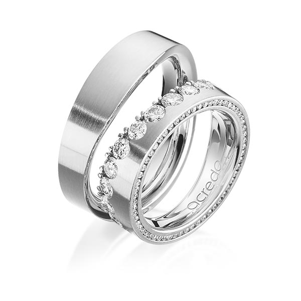Set klassieke Memoire-trouwringen in witgoud 14 kt. half gezet met in totaal 1,385 ct. Briljant tw/si van acredo