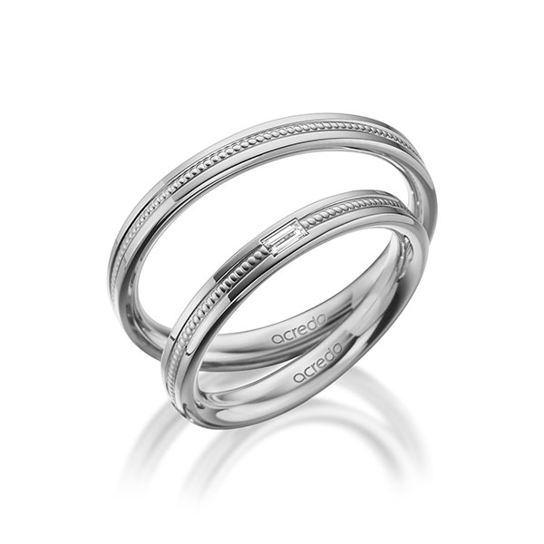 Set Klassieke trouwringen in buiten grijsgoud 14 kt. , binnen grijsgoud 14 kt. met in totaal 0,05 ct. Baguette-Diamant tw,vs van acredo