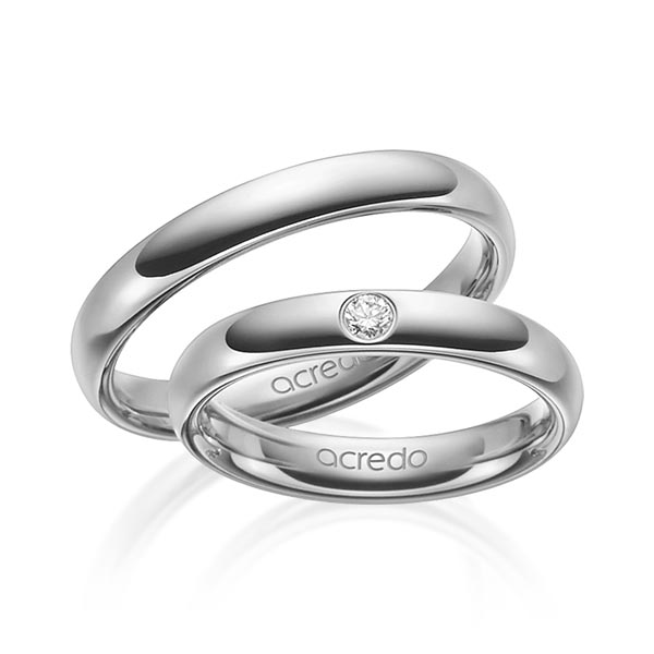 Set klassieke trouwringen in buiten grijsgoud 14 kt. , binnen grijsgoud 14 kt. met in totaal 0,06 ct. Briljant tw/si van acredo