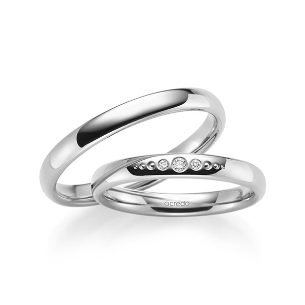 Set klassieke trouwringen in buiten witgoud 14 kt. , binnen witgoud 14 kt. met in totaal 0,036 ct. Briljant tw/si van acredo