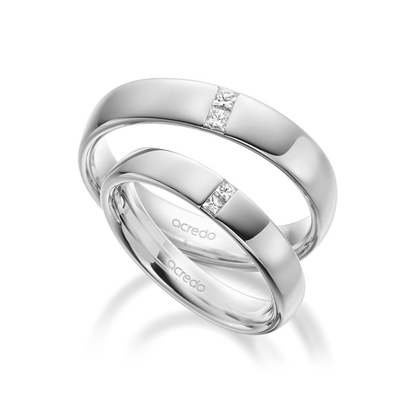 Set klassieke trouwringen in buiten witgoud 14 kt. , binnen witgoud 14 kt. met in totaal 0,18 ct. Princess-Diamant tw/si van acredo