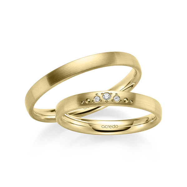 Set klassieke trouwringen in geelgoud 14 kt. met in totaal 0,031 ct. Briljant tw/si van acredo