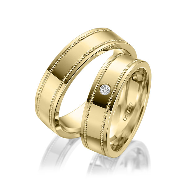 Set Klassieke trouwringen in geelgoud 14 kt. met in totaal 0,05 ct. Briljant tw/si van acredo