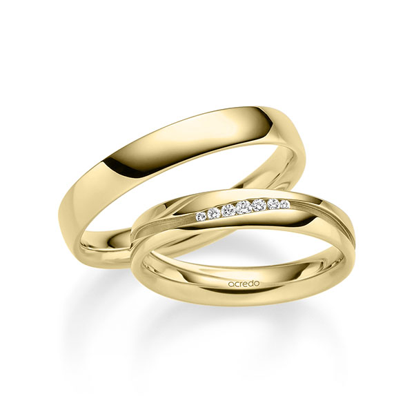 Set klassieke trouwringen in geelgoud 14 kt. met in totaal 0,063 ct. Briljant tw/si van acredo