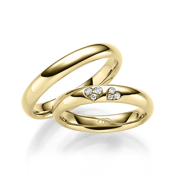 Set Klassieke trouwringen in geelgoud 14 kt. met in totaal 0,065 ct. Briljant tw/si 