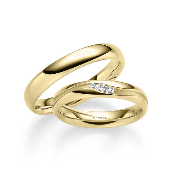 Set klassieke trouwringen in geelgoud 14 kt. met in totaal 0,085 ct. Briljant tw/si van acredo