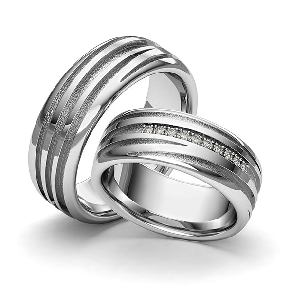 Set klassieke trouwringen in grijsgoud 14 kt. Laser Structuur met in totaal 0,09 ct. Briljant tw/si van Eternal Touch