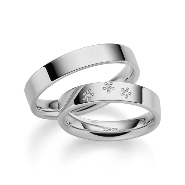 Set klassieke trouwringen in grijsgoud 14 kt. met in totaal 0,015 ct. Briljant tw/si van acredo