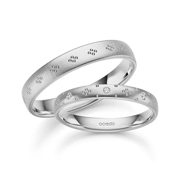 Set Klassieke trouwringen in grijsgoud 14 kt. met in totaal 0,072 ct. Briljant tw,vs van acredo