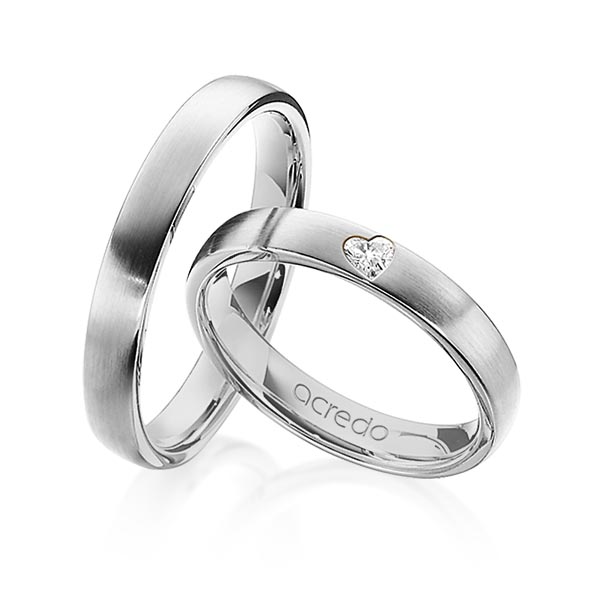 Set klassieke trouwringen in grijsgoud 14 kt. met in totaal 0,08 ct. Hart-Diamant tw,vs van acredo - A-1242-2 Set klassieke trouwringen in grijsgoud 14 kt. met in totaal 0,08 ct. Hart-Diamant tw,vs van acredo - A-1242-2