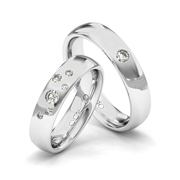 Set klassieke trouwringen in grijsgoud 14 kt. met in totaal 0,24 ct. Briljant tw/si van acredo