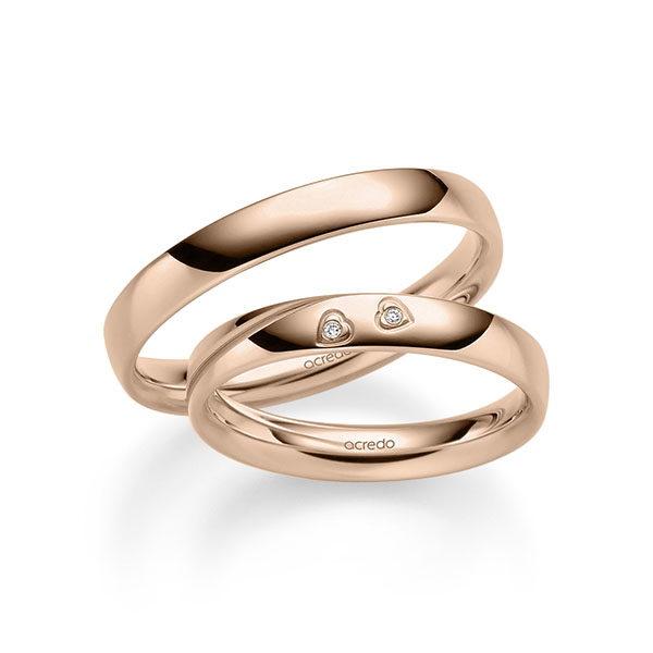 Set klassieke trouwringen in roodgoud 14 kt. met in totaal 0,01 ct. Briljant tw/si van acredo