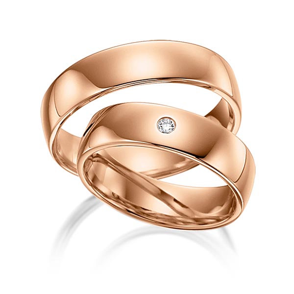 Set klassieke trouwringen in roodgoud 14 kt. met in totaal 0,02 ct. Briljant tw/si van acredo