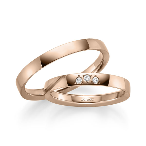 Set klassieke trouwringen in roodgoud 14 kt. met in totaal 0,045 ct. Briljant tw/si van acredo