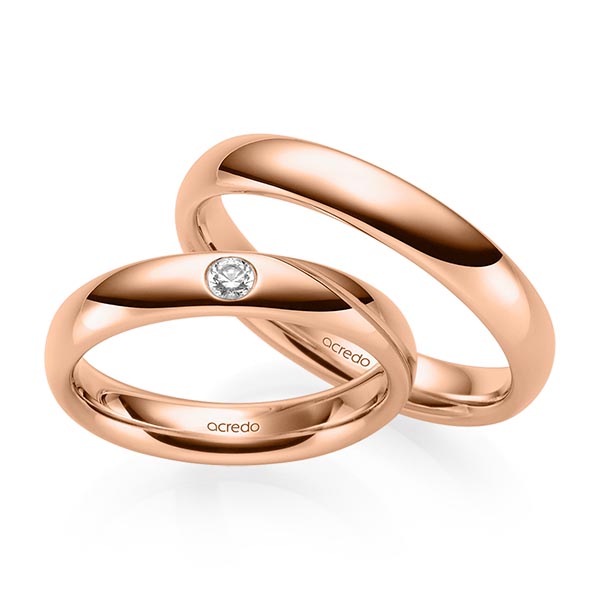 Set klassieke trouwringen in roodgoud 14 kt. met in totaal 0,07 ct. Briljant tw/si van acredo