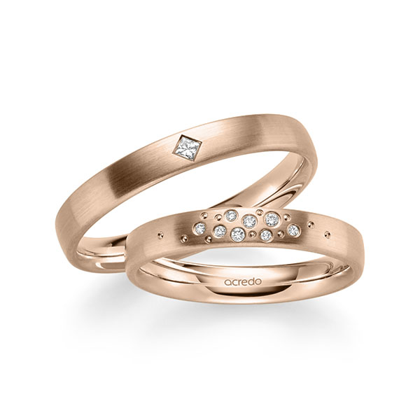 Set klassieke trouwringen in roodgoud 14 kt. met in totaal 0,081 ct. Briljant & Princess-Diamant tw/si van acredo