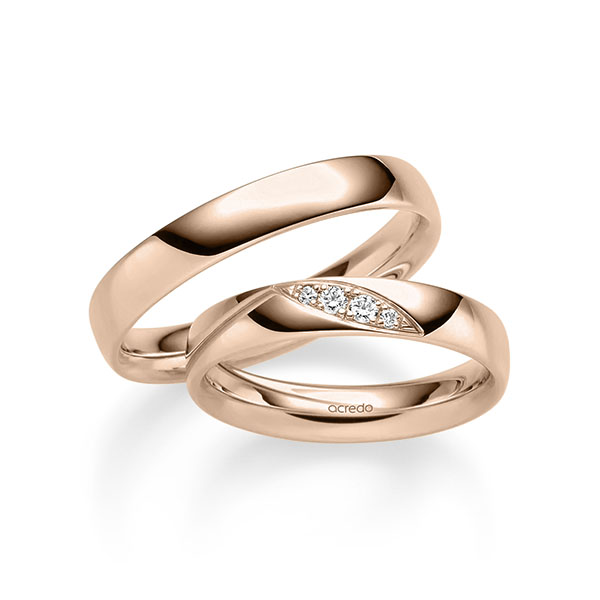 Set klassieke trouwringen in roodgoud 14 kt. met in totaal 0,08 ct. Briljant tw/si van acredo