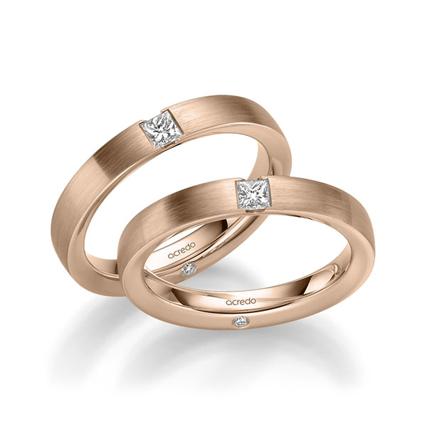 Set klassieke trouwringen in roodgoud 14 kt. met in totaal 0,44 ct. Princess-Diamant & Briljant tw/si van acredo