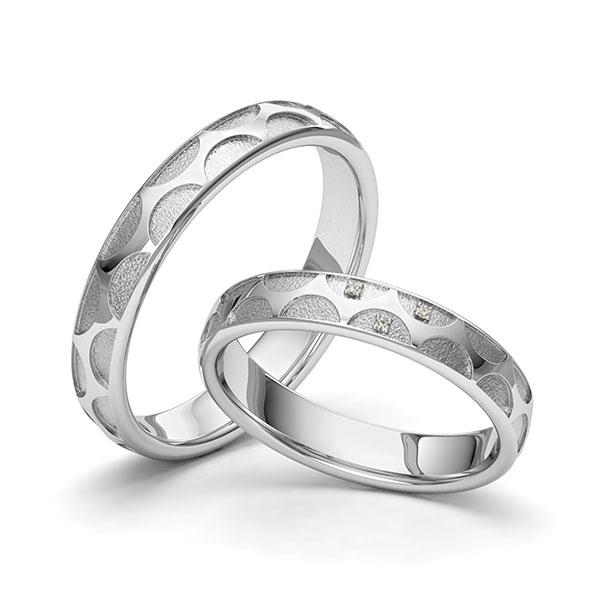 Set klassieke trouwringen in witgoud 14 kt. Laser Structuur met in totaal 0,015 ct. Briljant tw/si van Eternal Touch