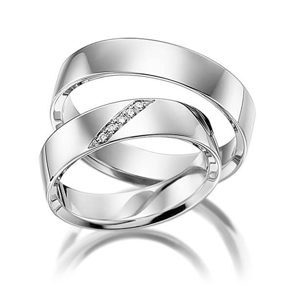 Set klassieke trouwringen in witgoud 14 kt. met in totaal 0,025 ct. Briljant tw/si van acredo