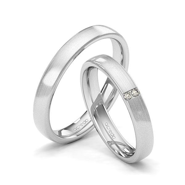 Set klassieke trouwringen in witgoud 14 kt. met in totaal 0,03 ct. Briljant tw/si van acredo