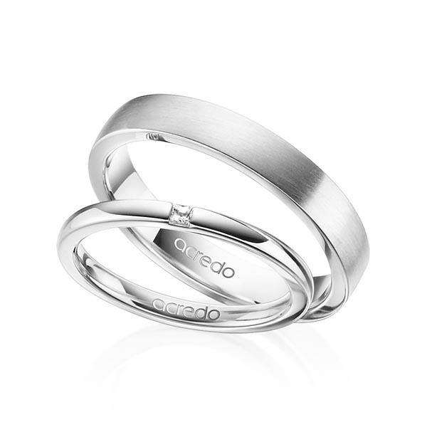 Set klassieke trouwringen in witgoud 14 kt. met in totaal 0,03 ct. Princess-Diamant tw/si van acredo