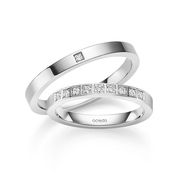 Set klassieke trouwringen in witgoud 14 kt. met in totaal 0,155 ct. Briljant & Princess-Diamant tw,vs van acredo