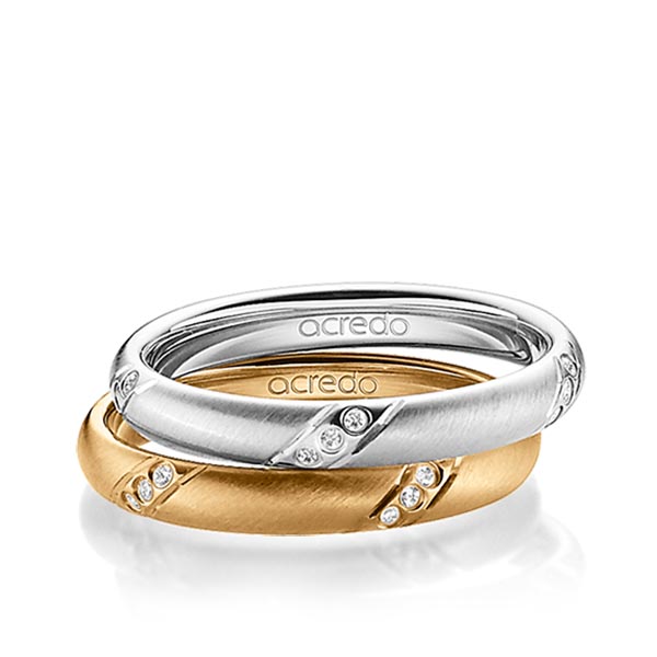 Set klassieke trouwringen in witgoud 14 kt. met in totaal 0,15 ct. Briljant tw/si van acredo