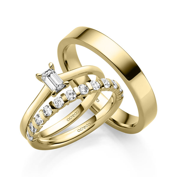 Triset in geelgoud 14 kt. met 0,4 ct. + in totaal 0,6 ct. Briljant tw,vs van acredo