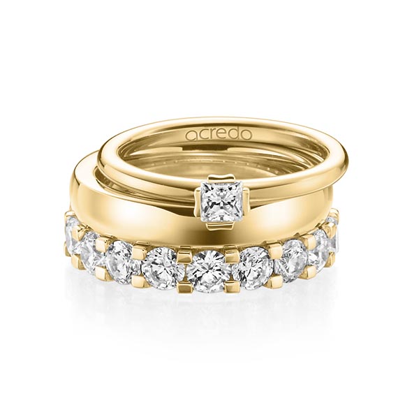 Triset in geelgoud 18 kt. met in totaal 3,29 ct. Princess-Diamant & Briljant tw/si tw,vs van acredo
