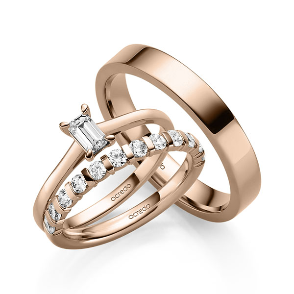 Triset in roodgoud 14 kt. met 0,4 ct. + in totaal 0,6 ct. Briljant tw,vs van acredo