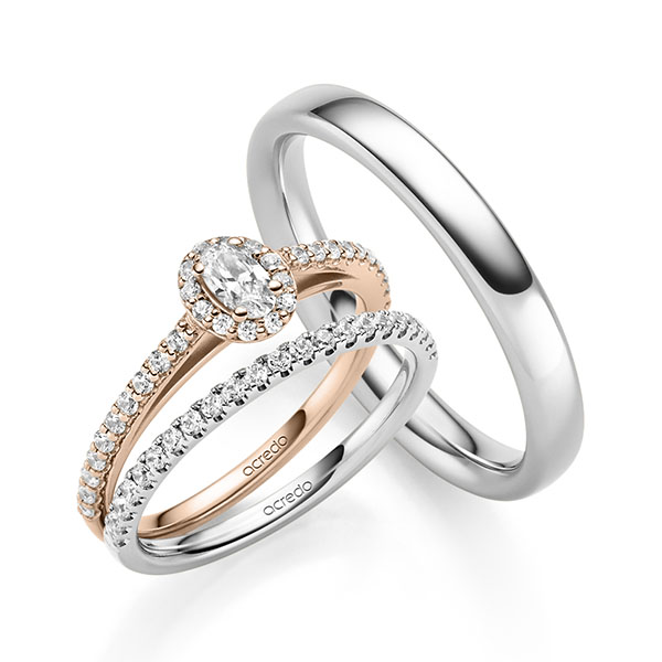 Triset in roodgoud 14 kt. met in totaal 0,704 ct. Briljant tw,vs tw/si van acredo