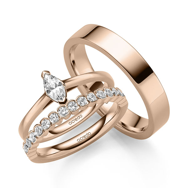 Triset in roodgoud 14 kt. met in totaal 0,71 ct. Briljant tw,vs tw/si van acredo
