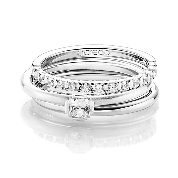 Triset in witgoud 14 kt. half gezet met in totaal 0,55 ct. Briljant & Princess-Diamant tw,vs tw/si van acredo