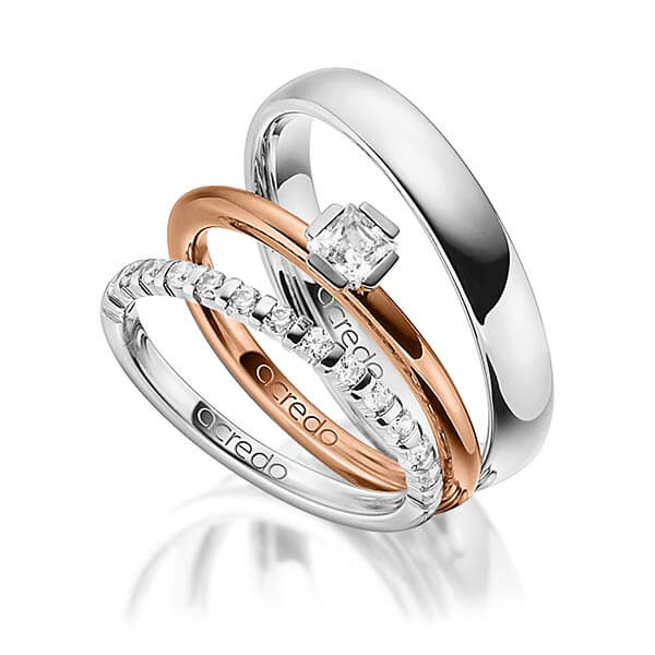 Triset in witgoud 14 kt. half gezet met in totaal 0,64 ct. Briljant & Princess-Diamant tw,vs tw/si van acredo