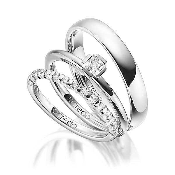 Triset in witgoud 14 kt. half gezet met in totaal 0,64 ct. Briljant & Princess-Diamant tw,vs tw/si van acredo