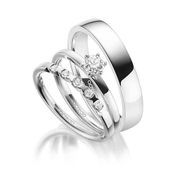 Triset in witgoud 14 kt. met 0,3 ct. + in totaal 0,1 ct. Briljant tw,vs van acredo