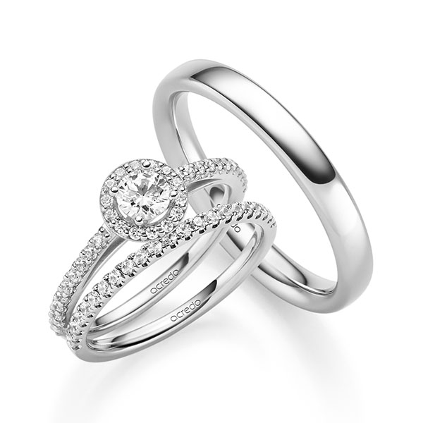 Triset in witgoud 14 kt. met 0,3 ct. + in totaal 0,518 ct. Briljant tw,vs tw/si van acredo